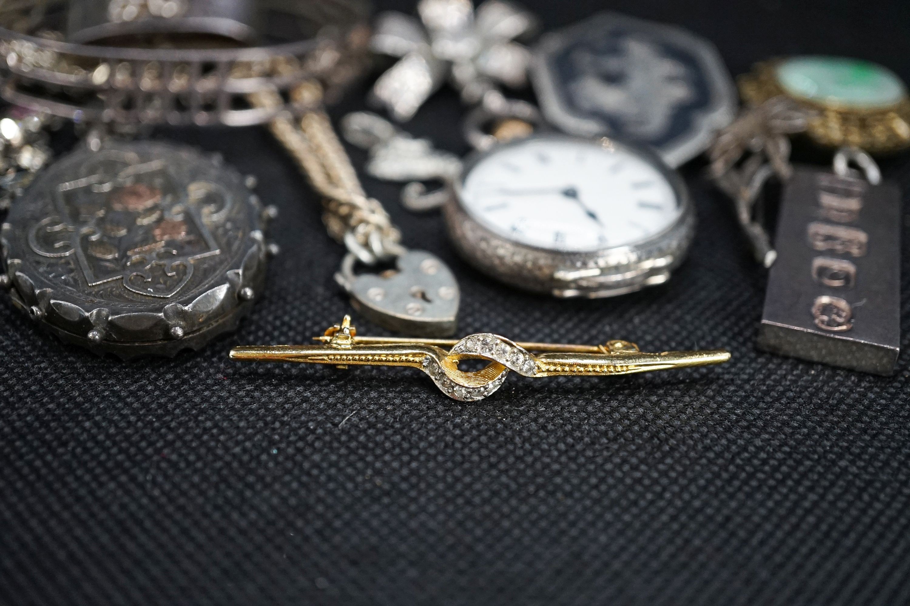 A silver fob watch, a late Victorian silver oval locket and other items of minor jewellery.